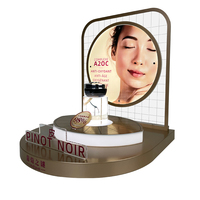 Support de présentation de cosmétiques et de soins de la peau en acrylique sur base dorée à l'huile moderne et haut de gamme, double couche, avec éclairage LED, table antivol pour parfums