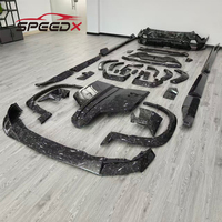 Kit carrosserie en fibre de carbone Mansory pour BMW XM : Lame avant XM, diffuseur de pare-chocs arrière, jupes latérales, élargisseurs d'ailes, spoiler