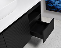 Meuble-lavabo flottant ovale noir mat cannelé de style industriel moderne avec lavabo à poser, capteur tactile intelligent et LED à intensité variable pour hôtels et villas