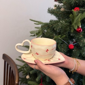 New Products 2025 Creamy <strong>White</strong> Ceramic Coffee <strong>Tea</strong> Cups Handmade Heart Shape Coffee <strong>Set</strong> Bow Porcelain Mugs and Saucer - Product Image 2