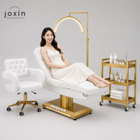 Table de massage électrique professionnelle à 3 moteurs, personnalisable, en cuir blanc, pour soins du visage et des cils, idéale pour salons et spas.