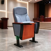 Chaise de théâtre ergonomique à base fixe avec dossier haut et tablette pliable, conçue pour les projets scolaires et de conférence