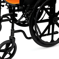 Fauteuil roulant pliable manuel à cadre en acier avec frein linéaire et coussin en maille orange pour la mobilité intérieure/extérieure