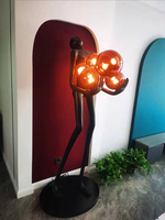 Lampe sur pied de forme humaine haut de gamme noire à forte vente, éclairage intérieur moderne et design intéressant