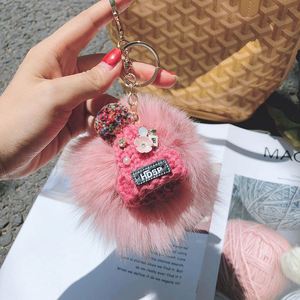 New Elegant Faux Fur Hairball <b>Key</b> <b>Chain</b> Cute Hat <b>Key</b> Ring Soft Fluffy Ball Purses Phone Charm - Product Image 1