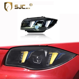 Phare avant SJC Auto Part pour <span class=keywords><strong>BMW</strong></span> Série 1 <span class=keywords><strong>E87</strong></span>, double couleur jaune et blanc, style DRL Snake Eyes - Product Image 1