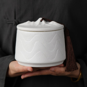 MSH Mountain Shape Lid Matte Ceramic Tea Canister with Embossed Wave Pattern and Tassel Decor Airtight Zen Style Storage Jar - Product Image 1