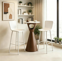 Table basse circulaire moderne minimaliste à pieds hauts pour l'extérieur, idéale pour les cafés et les espaces de loisirs