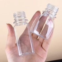 Bouteille de jus de gingembre en plastique PET de 60 ml, forme ronde, prix d'usine, avec bouchon à vis, bouteille de 2 oz pour jus et boissons énergisantes
