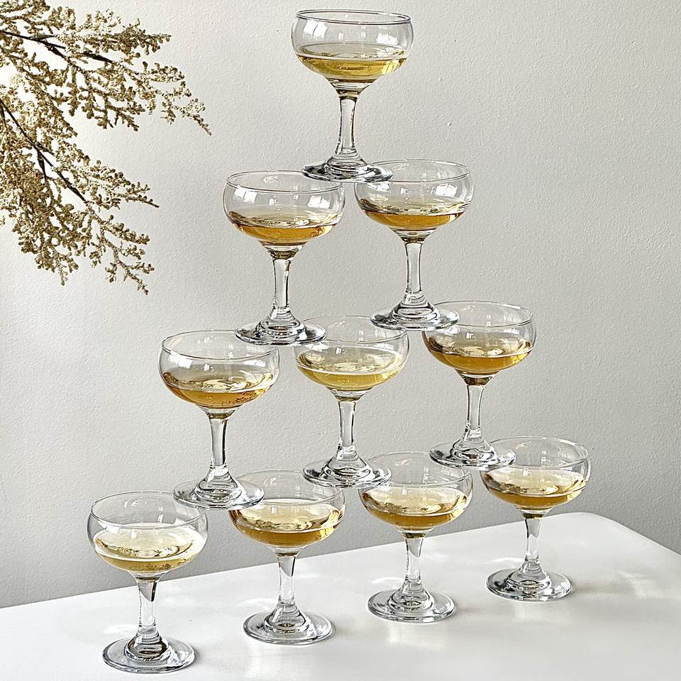 Rounded champagne coupes arranged in tiers in a source photograph