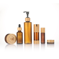 Emballage de maquillage et de soins de la peau Ensemble de bouteilles vides de luxe en bambou Bouteille en verre ambré avec couvercle en bambou Ensemble de voyage pour soins de la peau