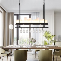 Lampe suspendue de style nordique noire pour restaurant et bar, avec un design distinctif en fer forgé et un porte-bougie en verre