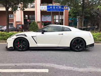 Nouveau pour GT-R (R35) Kit carrosserie amélioré style NISMO Pare-chocs Jupes latérales Passage de roue Capot Spoiler Diffuseur Fibre de carbone