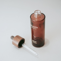 Ensemble de bouteilles en verre à couvercle en noyer personnalisé haut de gamme pot de crème à couvercle en bois foncé emballage en verre personnalisé personnalisé