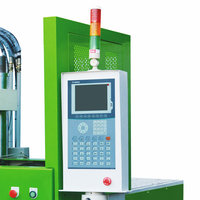 Machine de moulage par injection verticale à double table coulissante pour la fabrication de fiches et l'overmoulage de connecteurs électriques en plastique