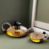 Nouvelle carafe à café en verre transparent avec couvercle noir, résistante à la chaleur, épaissie, pour usage domestique, avec filtre, pour la préparation du thé.