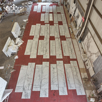 Carreaux de marbre poli de luxe GOLDTOP pour les murs des galeries d'art et les décors de présentation des musées