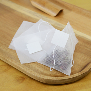 Bolsas de té vacías de forma <span class=keywords><strong>triangular</strong></span> de malla <span class=keywords><strong>PLA</strong></span> portátil con etiqueta e hilo para bolsas de té de hojas sueltas - Product Image 2