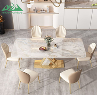 Ensemble de table à manger Wayon Luxury Gold avec plateau en pierre frittée brillante, base géométrique en métal et chaises rembourrées