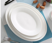 Design moderne Grande assiette ovale en céramique Blanc pur Vaisselle de restaurant Fournitures d'hôtel écologiques pour quantité minimale de commande de poisson à la vapeur 20pcs