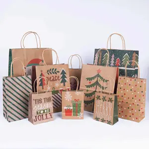 Sacchetti di carta kraft per lo shopping di imballaggi flessibili natalizi con vari stili possono essere stampati logo
