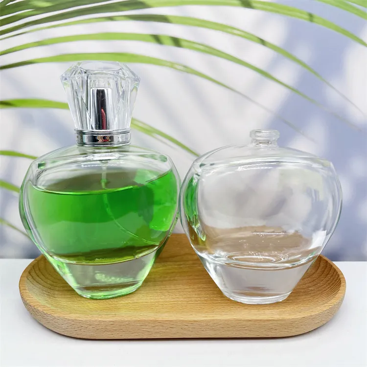 Botellas de perfume de recarga vacías de vidrio de color transparente de forma ovalada de 115ml