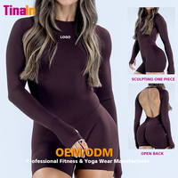 Tinain OEM ODM Combinaison de yoga une pièce à manches longues pour femme, avec soutien-gorge intégré sculptant et effet froncé aux fesses, pour le Pilates et l'entraînement