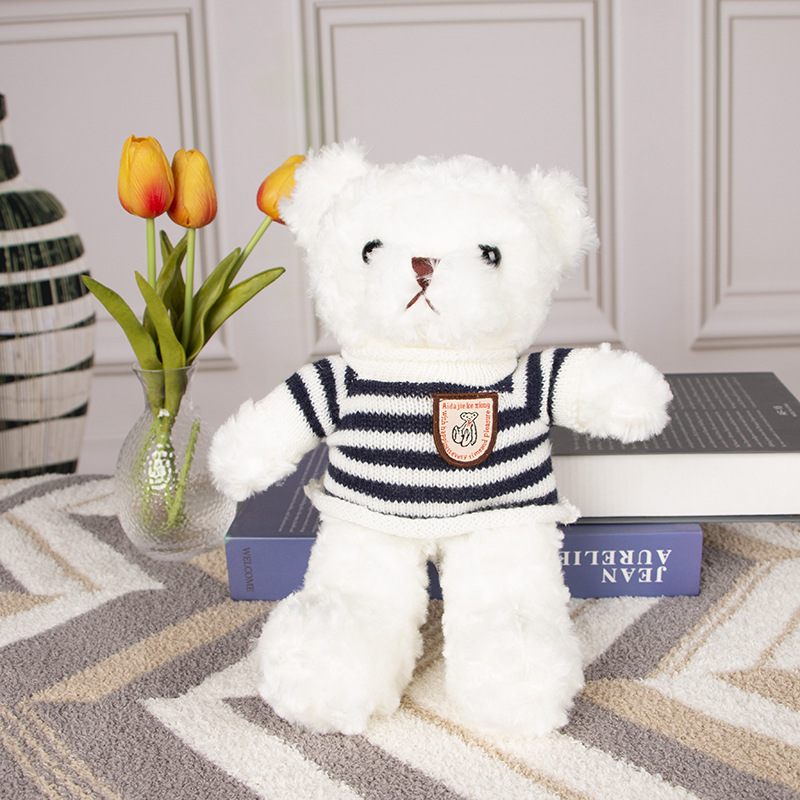 Pull rayé noir et blanc ours blanc