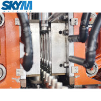 Chine nouvelle conception entièrement automatique eau minérale rotatif PET bouteille en plastique soufflage Machine de moulage par soufflage à grande vitesse