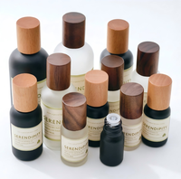 Flacon diffuseur en verre noir mat avec couvercle en bois naturel, étiquette personnalisée, forme cylindrique, impression sérigraphique, huile essentielle, cosmétique