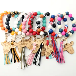 2023 en Stock perles de bois colorées tête de vache Clip Bracelet porte-clés femmes Pu cuir gland poignet porte-clés cadeau