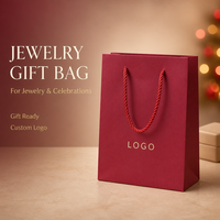 Sac cadeau en papier de luxe avec logo personnalisé et poignées en corde pour l'emballage de vente au détail en boutique