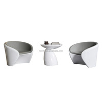 Combinaison moderne de table de réception et de fauteuil lounge avec table basse en fibre de verre écologique et cuir PU pour salon