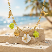 Collier à chaîne épaisse en acier titane style vacances à la plage avec pendentifs multiples étoile de mer, coquille Saint-Jacques et hippocampe pour femme