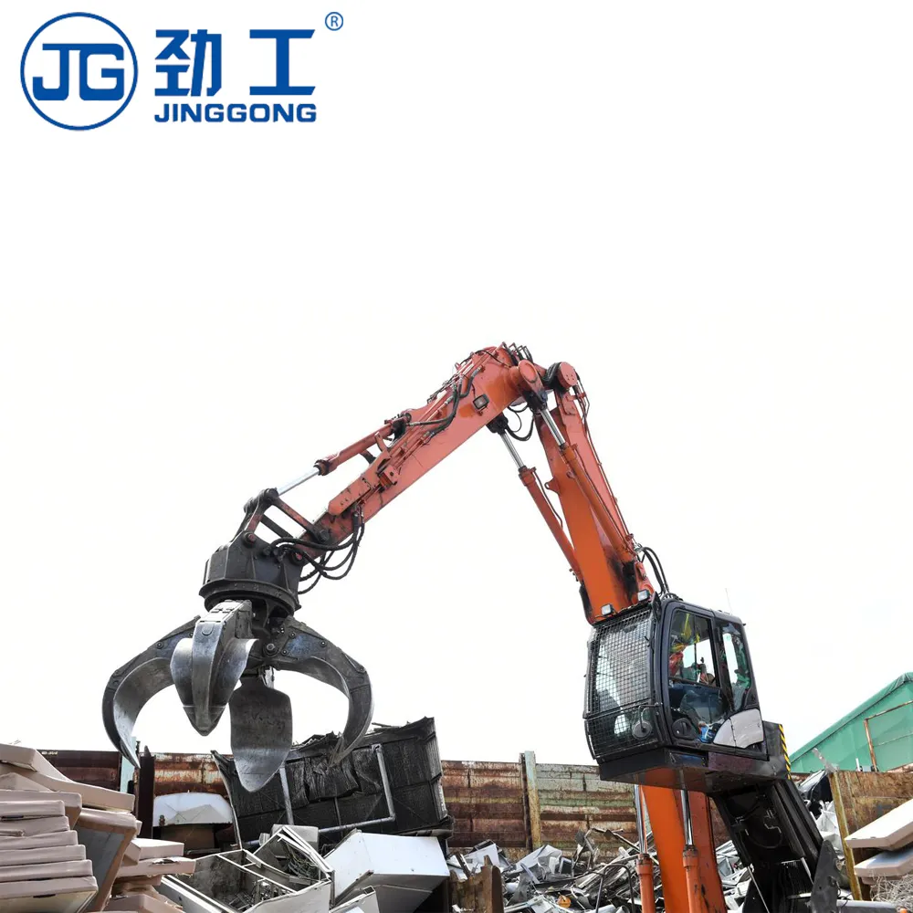 Jinggong excavator scrap yard equipment crane sorting through a pile of scrap metal