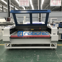 Machine de découpe de tissu CNC à alimentation automatique 1610 graveur de logo laser textile en cuir avec lit d'alimentation automatique 80w 100w 150w 180w prix