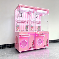 Machine à griffes commerciale rose avec éclairage LED, armoire à prix transparente, commande par joystick et système à monnayeur