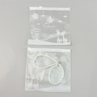 Pochette d'emballage personnalisée en PVC transparent imprimé motif dessin animé avec fermeture éclair refermable et trou de suspension pour colliers, bijoux et jouets squishy