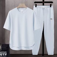 Ensemble deux pièces sport d'été fin pour homme et femme : T-shirt streetwear à manches courtes et pantalon décontracté – Vente en gros
