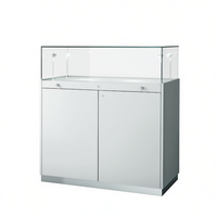 Comptoir d'exposition moderne 100x50x110cm blanc brillant avec plateau en verre et éclairage LED pour la vente au détail