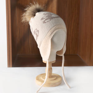 Шерстяная (100% шерсть) очень теплая зимняя дышащая детская вязаная шапка с помпоном и наушниками для активного отдыха, катания на лыжах, велоспорта и путешествий - Product Image 1