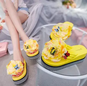 Thick bottom sandals women's 2022 summer new fashion sweet flowers butterfly sponge cake bottom wedge heel ladies flip flops