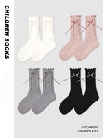 Vente en gros de chaussettes pour enfants avec des rubans et des nœuds de couleurs unies en dentelle de champignon pour filles pour enfants