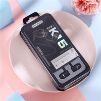 Vente en gros K Series K15 Écouteurs intra-auriculaires de sport Basses lourdes Contrôle filaire Nouvelle boîte-cadeau en cristal Indicateur de batterie LED