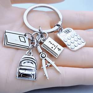 Accessoires de mode : Mini <span class=keywords><strong>sac</strong></span> <span class=keywords><strong>à</strong></span> <span class=keywords><strong>dos</strong></span> pendentif en métal étanche, motif dessin animé, avec calculatrice, règle et livre – Cadeau <span class=keywords><strong>pour</strong></span> la Fête des Enseignants et le début du nouveau semestre - Product Image 6