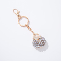 Élégant porte-clés de sac à main en perles, avec fermoir mousqueton en alliage, anneau porte-clés, pendentif breloque de sac avec strass brillants, accessoire de mode féminin, cadeau
