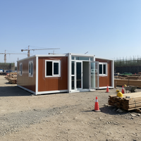 Zhanshun Tiny House Conteneur Extensible de 20 pieds, Noir, avec Mur Rideau en Verre Frontal au Design Carré Contemporain et Verrière, Garantie 1 an