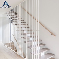 Escalier flottant à tube carré avec structure à poutre unique, doté d'éclairage LED pour les marches et d'escaliers en bois