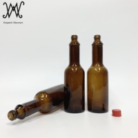 Bouteille en verre pour sauce piquante de couleur ambre de 2oz avec couvercle en plastique