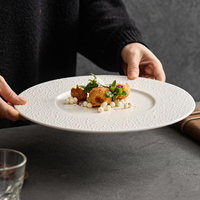 Assiette plate moderne minimaliste en céramique brillante mouchetée motif grain de sésame blanc, style nordique contemporain, compatible micro-ondes, ronde